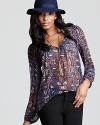 Aqua's breezy blouse in a pretty paisley print brings statement style to your off-duty looks.