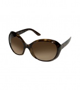 Blend out the sun in glamorous style in Pradas oversized gradient sunnies - Tonal brown mock tortoise wrap-around plastic frames, gradient brown lenses, gold-toned metal insert and logo stamp at temples - Lens filter category 3 - Comes with a logo embossed hard carrying case