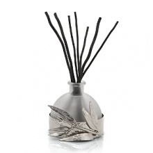 This captivating diffuser by Michael Aram features notes of sandalwood, musk, French lotus, bamboo, waterlily and green ivy. Soothing and sensual, it's an intoxicating scent for the home. This captivating diffuser by Michael Aram features notes of sandalwood, musk, French lotus, bamboo, waterlily and green ivy. Soothing and sensual, it's an intoxicating scent for the home.
