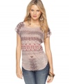 Go global-boho with this GUESS? aztec-inspired printed top that adds free-spirited flavor to your fave denim!