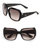 Glossy and glamourous, these chic frames feature matte, textured temples with logo detailing. Available in shiny black with brown gradient lens. Logo temples100% UV protectionMade in Italy 