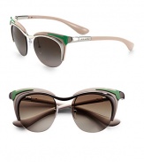 A nod to the mod times, a round lens is complimented by a colorful plastic and metal cat's-eye frame. Available in red on pink with silver mirror lens or green on beige with brown gradient lens.Logo temples100% UV protectionMade in Italy 