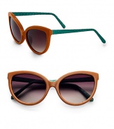 This unique and tactile style features a supple leather, retro-inspired frame with luxurious snakeskin temples. Available in brown leather-green skin with smoke gradient lens. Leather wrapped framesSnakeskin temples100% UV protectionImported