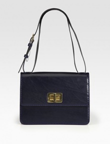 Butter-smooth leather takes on a lady-like silhouette in this gorgeous flap design finished with polished turnlock hardware.Adjustable shoulder strap, 9½-11¾ dropTurnlock flap closureOne outside open pocketOne inside zip pocketThree inner compartmentsLeather lining11W X 8H X 3½DMade in Italy Butter-smooth leather takes on a lady-like silhouette in this gorgeous flap design finished with polished turnlock hardware.Adjustable shoulder strap, 9½-11¾ dropTurnlock flap closureOne outside open pocketOne inside zip pocketThree inner compartmentsLeather lining11W X 8H X 3½DMade in Italy