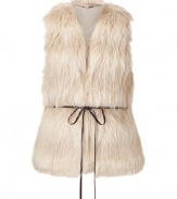 Chic natural vest in fine synthetic blend fur - An elegant and trendy must - Silhouette cuts close to the body - Sexy V-neckline and skinny ribbon belt at waist - Bohemian look channels 70s-era glamour - A truly versatile piece that pairs perfectly with long-sleeve blouses and shirts, skinny denim, pencil skirts and leather leggings