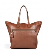 Detailed in classic brown leather with a streamlined look, Marc by Marc Jacobs timeless tote lends a polished edge to every outfit - Zippered front pocket with luggage tag, metallic embossed logo, double top handles, zippered top, inside zippered back wall pocket, front wall slot pockets - Perfect for work, school, or weekend shopping