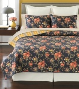 Beauty in bloom. Create a relaxing retreat in your space with this Evening Garden sham from Martha Stewart Collection, featuring a luxurious landscape of delicate buds on a deep, rich backdrop. Flip the quilt for a bright yellow strip pattern.