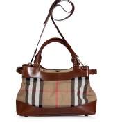Updated with sleek modern hardware and detailed in the brands house check, Burberry Londons convertible leather trimmed tote counts as a multi-season must - Double top handles, removable belted shoulder strap, belted side straps, gold-toned logo hardware, magnetic top snaps, two internal sections with a zippered middle pocket, inside back wall zippered pocket, protective feet - Carry as a sophisticated compliment to polished daytime looks