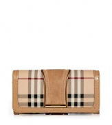 With its characteristic check and modern metallic piping, Burberry Londons continental wallet is an iconic way to keep your most valuable essentials organized - Haymarket check coated canvas, trench suede panel, matching leather trim, flap with snap closure, back slot pocket, multiple credit card slots inside, zippered coin purse - Carry alone for running quick errands, or stash away in a sophisticated leather tote