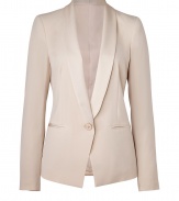 With its sharply tailored fit and timeless classic styling, DKNYs pristine tuxedo blazer is a workweek essential - Satin shawl lapel, long sleeves, single button closure, satin trimmed front slit pockets - Tailored fit - Pair with a sheath dress for cocktails, or for work with a pencil skirt and peep-toes