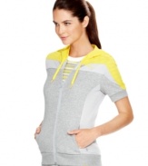 Warm up your workout in Puma's short-sleeved jacket. Colorblocked mesh panels recall sporty vintage styling -- so cool!