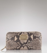 A glazed finish lends added luxe to this python-embossed leather wallet from MICHAEL Michael Kors.