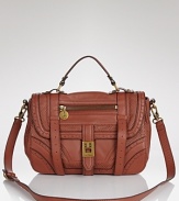 Tap an equestrian-inspired ethos with this leather and linen saddle bag from Sam Edelman. Combining textures and tones, its a versatile accent for your daytime looks.