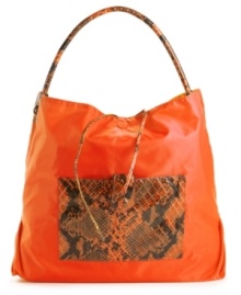 A casual nylon silhouette accented with a bold snakeskin print. This go-anywhere hobo will add a fiercely fun feel to any outfit. Bonus: this style is reversible! A casual nylon silhouette accented with a bold snakeskin print. This go-anywhere hobo will add a fiercely fun feel to any outfit. Bonus: this style is reversible!