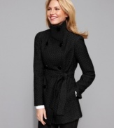 Striking details make Calvin Klein's coat stand out. A funnel neckline and wide-set double-breasted buttons create a streamlined silhouette, while the textured fabric gives it a modern twist.