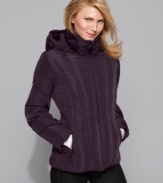 Try a new take on a classic: channel quilting elongates, while the fitted silhouette gives Calvin Klein's puffer a chic, citified look.
