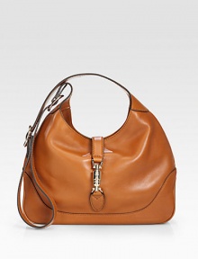 Leather shoulder bag with a single adjustable strap and metal piston closure.Adjustable shoulder strap, 8¾-19¾ drop Metal piston strap closure Inside zip, cell phone and PDA pockets Linen lining 13W X 8¾H X 2¾D Made in Italy Leather shoulder bag with a single adjustable strap and metal piston closure.Adjustable shoulder strap, 8¾-19¾ drop Metal piston strap closure Inside zip, cell phone and PDA pockets Linen lining 13W X 8¾H X 2¾D Made in Italy