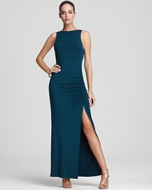 This formfitting Akiko maxi dress flaunts a ruched side slit for a tasteful hint of skin.