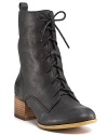 A stacked block heel toughens up these vintage-inspired lace-up boots by Lucky Brand.