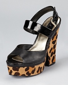 With a leopard printed heel and platform, these GUESS sandals make a slick statement for day or night. With a leopard printed heel and platform, these GUESS sandals make a slick statement for day or night.