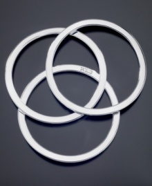 Streamline your style with this set of three smooth silvertone mixed metal bangle bracelets by GUESS. Logo etched on one bracelet. Approximate diameter: 2-2/1 inches. Streamline your style with this set of three smooth silvertone mixed metal bangle bracelets by GUESS. Logo etched on one bracelet. Approximate diameter: 2-2/1 inches.