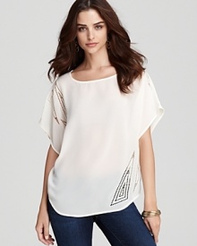 Tonal embroidery adds just enough interest to this go-anywhere GUESS top.