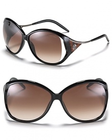 Textured metal and intricate logo detail complement the vented temples of these chic oversized sunglasses by Roberto Cavalli. Textured metal and intricate logo detail complement the vented temples of these chic oversized sunglasses by Roberto Cavalli.