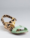 Leopard calf hair heats up a cool mint hue on the mixed-material Janee sandal from DIANE von FURSTENBERG.