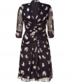 Luxe dress in fine black-patterned silk features a beautiful floral print on the light, flowing fabric - Feminine silhouette with v-neckline and draped front - Fashionable 3/4-length sleeves - Slightly flared skirt for a pleasant thigh length that is perfect for the office or evening events - Pair with peep-toe pumps and sandals