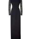 Showcase your sultry style in this luxe lace cut out gown from Michael Kors - Round neck, long lace sleeves, fitted bodice with lace cut outs, long column skirt with high front slit, exposed back zip closure - Pair with sky-high heels and an embellished clutch