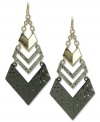 Let cutting-edge style in. A stylish doorknocker earring design from GUESS shines with glass stone accents. Set in imitation rhodium, shiny gold and hematite tone mixed metal. Approximate drop length: 3 inches. Approximate drop width: 1-1/2 inches.