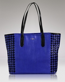 Punch up your accessories portfolio. This roomy leather tote bag from Cole Haan, with it's woven detailing, is a playful yet practical way to do it. Punch up your accessories portfolio. This roomy leather tote bag from Cole Haan, with it's woven detailing, is a playful yet practical way to do it.