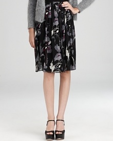 Imbue your everyday look with effortless romance in a DKNY skirt blooming with dark florals and dramatic pleats.