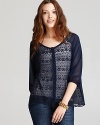 Bring charming femininity to your favorite jeans with this floaty Sanctuary top, tailored in delicate lace chiffon.