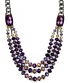 Seasonally stylish. Update your fall wardrobe with AK Anne Klein's chic collar necklace. Crafted in hematite tone mixed metal, it's embellished with beautiful beading in a rich purple hue. Approximate length: 18 inches.