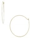 Add a little urban flavor with a whisper-thin pair of hoops. Michael Kors simple, yet stunning, style is crafted in gold tone mixed metal. Approximate diameter: 2-1/4 inches.