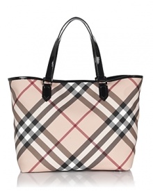 Burberry's roomy and versatile coated canvas tote bag in the brand's iconic check print with leather trims. Burberry's roomy and versatile coated canvas tote bag in the brand's iconic check print with leather trims.