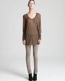 This draped, loose fitting HELMUT ribbed top replaces the tee with modern style, downtown cool with soft leggings and lace-up booties. This draped, loose fitting HELMUT ribbed top replaces the tee with modern style, downtown cool with soft leggings and lace-up booties.