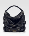 Stash your essentials in this slouchy leather silhouette, finished with buckled straps for a tailored look.Removable shoulder strap, 14 drop Top handle, 4 drop Protective metal feet Two inside zip pockets Cotton lining 14½W X 15H X 4¼D Imported