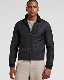 The trim, quilted nylon jacket keeps your look simple and sharp when the weather turns chilly. The trim, quilted nylon jacket keeps your look simple and sharp when the weather turns chilly.
