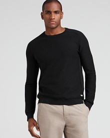 A bold look from Converse, this long sleeve cotton sweater adds texture with articulated shoulders and ribbed accents along the side. A bold look from Converse, this long sleeve cotton sweater adds texture with articulated shoulders and ribbed accents along the side.