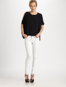 Cutout shoulders and a cropped back hem add edge to this sophisticated silk crewneck. CrewneckCutout shouldersThree-quarter flutter sleevesCropped back hemSilkDry cleanImportedModel shown is 5'10 (177cm) wearing US size Small.