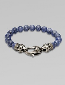 A new look for the modern man, handsomely crafted with a sterling silver raven's head clasp and a string of grey coral beads.Sterling silverLobster claspBracelet, 9 longAbout 3 diamImported A new look for the modern man, handsomely crafted with a sterling silver raven's head clasp and a string of grey coral beads.Sterling silverLobster claspBracelet, 9 longAbout 3 diamImported