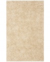 Add rich, shimmering ivory texture to any modern room with the Metallic area rug from Dalyn. Hand-tufted of soft polyester, this high-luster shag area rug puts comfort and fun back in floor decor.