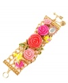 Beautifully in bloom! A gorgeous garland of roses sets apart Betsey Johnson's wide toggle bracelet. Embellished by a bird, a frog and leaves, it's also accented by glass pearls and sparkling crystals. Made in antique gold tone mixed metal. Approximate length: 7-1/2 inches.