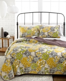 Embrace your wild side. Bold florals outfit the bedroom in modern style with this Mya sham, boasting allover scalloped quilted details for plush dimension and a touch of finesse. Reverses to solid purple for a toned down look. Embrace your wild side. Bold florals outfit the bedroom in modern style with this Mya sham, boasting allover scalloped quilted details for plush dimension and a touch of finesse. Reverses to solid purple for a toned down look.