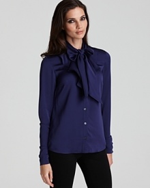 Anne Klein's bow-tie blouse brings on-trend elegance to workday style--perfect with a sleek pencil skirt or trousers. Anne Klein's bow-tie blouse brings on-trend elegance to workday style--perfect with a sleek pencil skirt or trousers.