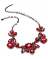 Paint the town red with this necklace from Style&co. Crafted from hematite-tone mixed metal, the necklace is adorned with red accents that are visually stunning. Approximate length: 16 inches. Approximate drop: 1 inch.