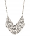 You're a soldier to great style. Bar III's innovative necklace combines a burnished armor design, polished silver tone mixed metal, and a trendy long chain setting. Approximate length: 37 inches. Approximate drop length: 3-1/2 inches. Approximate drop width: 1-7/8 inches.