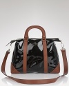 Practical style gets glossy with this patent leather satchel from kate spade new york. Ideal for the woman on the go, it's polished with a camel coat and pumps.